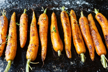 whole roasted carrots with tails, food close upの写真素材