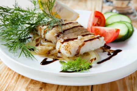 grilled fillet lemon sole with onion, food closeupの写真素材
