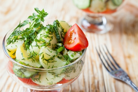 salad of new potatoes with cucumber and tomato, close upの写真素材