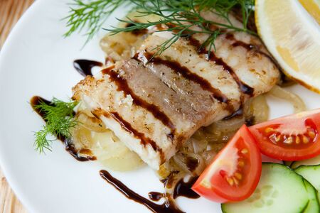 Fried fish with vegetables and sauce