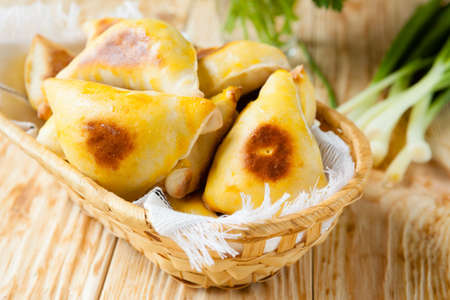triangles with onions and eggs, close upの写真素材