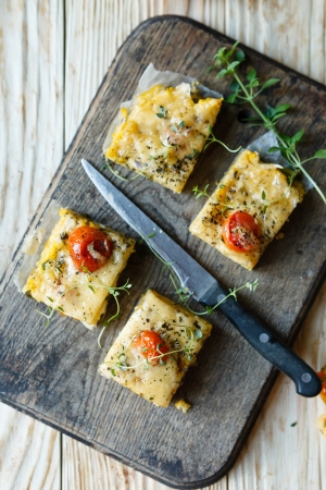 Polenta slices with cherry tomatoes, top view, foodの写真素材