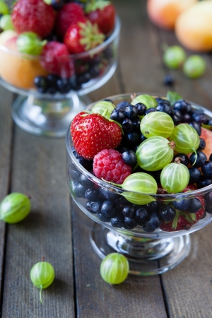 Mix garden berries in a bowl, food close upの写真素材