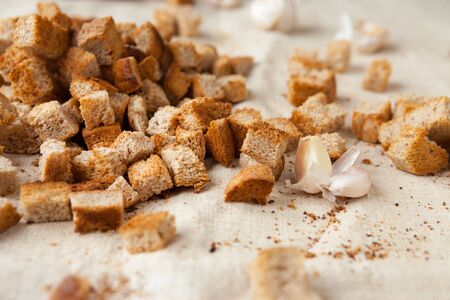 rye bread croutons on fabric, food close upの写真素材