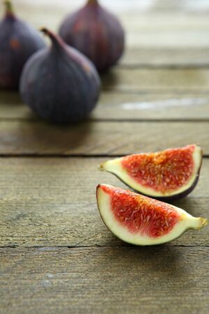 Ripe figs on wooden table, food close up