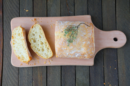 ciabatta on the board, top view, food closeup