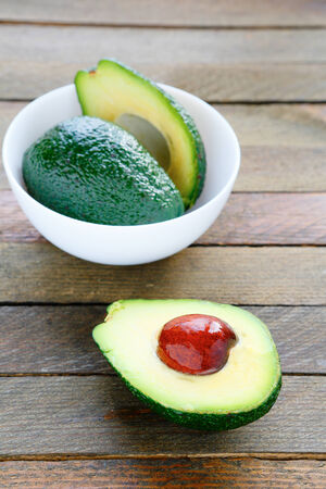 fresh avocado in a white bowlの写真素材