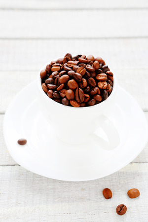 coffee beans in a white cup, hot drinkの写真素材