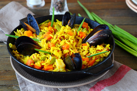 hot paella with vegetables and mussels, food closeupの写真素材