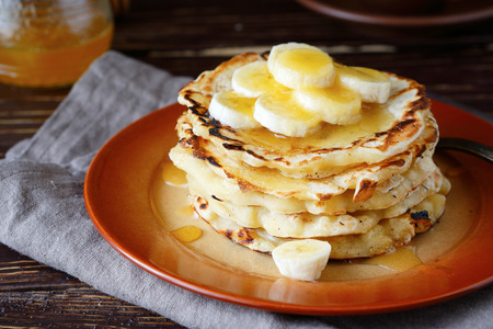 stack of pancakes with honey, food closeup