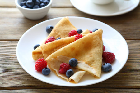 crepes with raspberries, blueberries, food closeupの写真素材