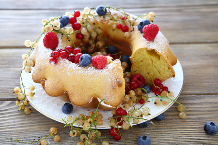 round cake with raspberries, blueberries, currants -  summer foodの写真素材