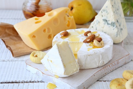 three kinds of cheese and honey on a white background, foodの写真素材