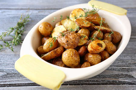 Baked potatoes in a bowl, food close-upの写真素材