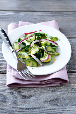 salad with cucumbers  on the plate, healthy foodの写真素材