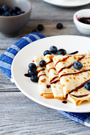 Sweet crepes on a white plate, side viewの写真素材