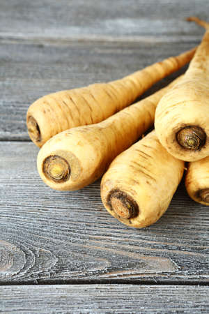 Raw Parsnip on wooden boards, foodの写真素材