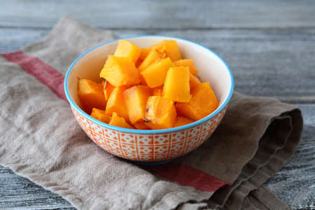 Pumpkin sweet stewed in a bowl on napkin, tasty foodの写真素材