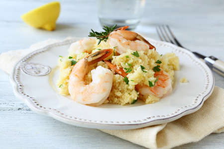 Nutritious couscous with shrimp. Seafoodの写真素材