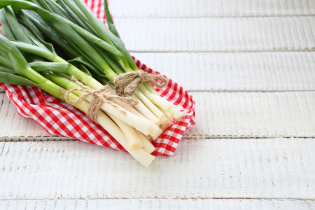 Fresh onions and garlic on a napkinの写真素材