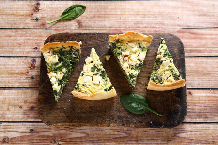Tasty slices pie on a cutting board, hot food