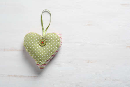 Green heart on a white background, holidayの写真素材