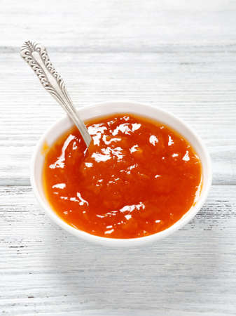 Jam in small white bowlの写真素材