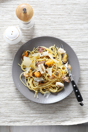 Delicious pasta with seafood on a plate, foodの写真素材