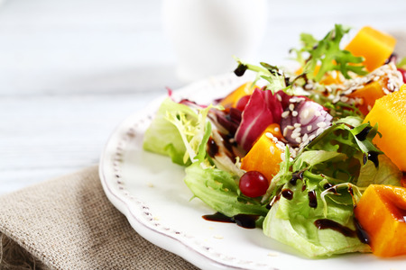 Salad with pumpkin in a bowl on the boards, foodの写真素材