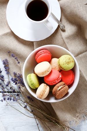 Macaroon in a bowl with black coffee, foodの写真素材