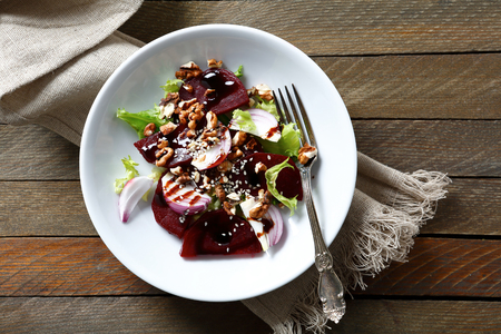 Salad with beetroot and walnuts on a plate, foodの写真素材