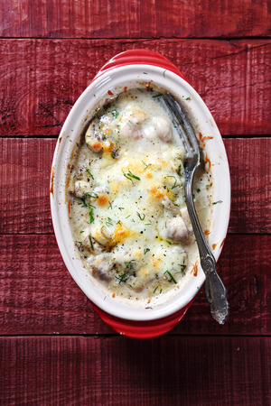 Mushrooms baked in cheese sauce on the boards, foodの写真素材