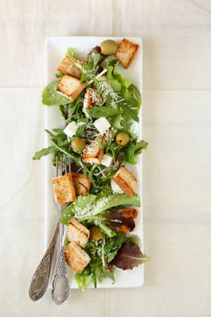 Croutons and cheese with arugula in salad, foodの写真素材