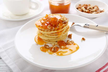 Stack of pancakes with apricots, dessert