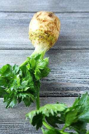 Celery with green leaves on a background of boards, foodの写真素材