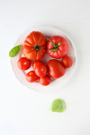 fresh tomato on a plate, food top viewの写真素材