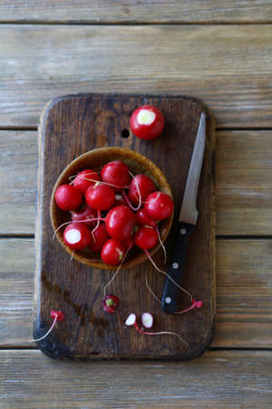 fresh radishes in a bowl top viewの写真素材