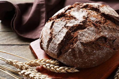 Whole bread on a cutting board, food