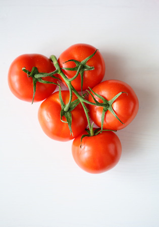ripe tomatoes on branch, food top viewの写真素材