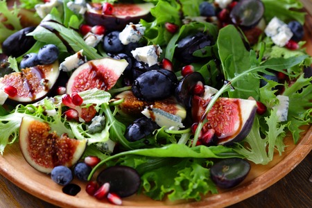salad with figs and cheese on plateの写真素材