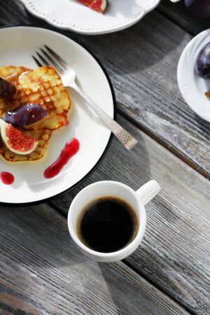 brunch pancakes with figs and coffee, food top