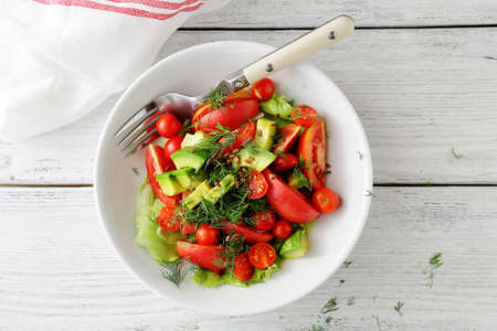 fresh salad with avocado, top viewの写真素材