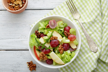 healthy salad with green apple and celery, food top viewの写真素材