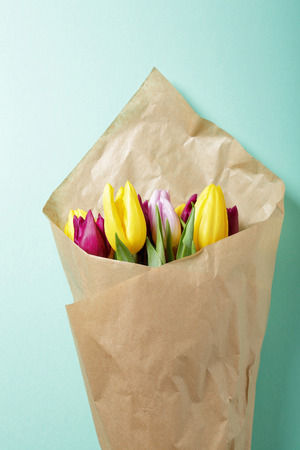 tulips wrapped in brown paperの写真素材