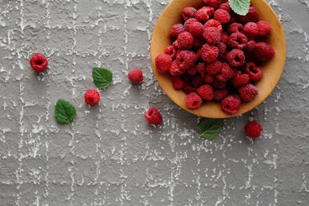 fresh raspberry in wooden bowl, aboveの写真素材