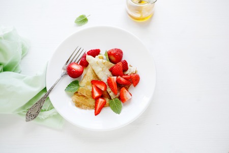 crepes with fresh strawberriesの写真素材