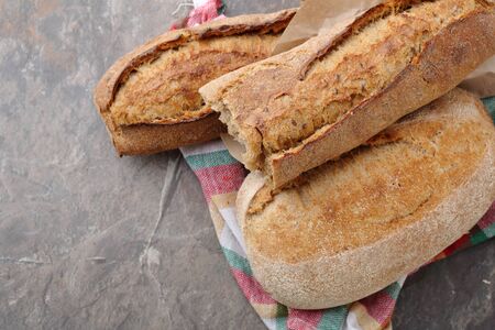 fresh breads on rustic napkin, food top view