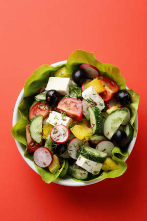 Greek salad in bowl, food top viewの写真素材