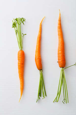 fresh carrots on white background, healthy foodの写真素材