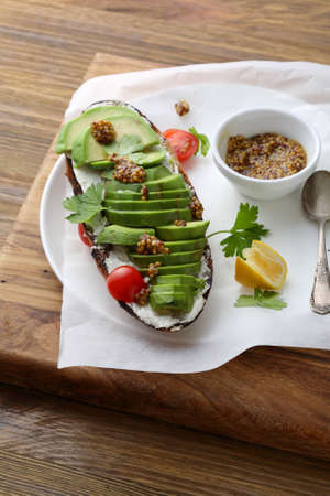 rye bread sandwich with avocado, food close-up